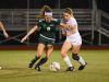 MCC’s Emily King (9) holds off Holy Trinity’s Piper McHenry (10) during a game on Jan. 5.