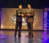 Gave Infante accepts his Army Bowl Coach of the Year trophy (Photo: AAG)