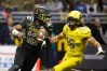 1/7/17 12:40:40 PM -- San Antonio, TX, U.S.A -- East quarterback Tua Tagovailoa (12) scrambles for yardage as he is pressured by West defensive lineman Jaelan Phillips (15) during U.S. Army All-American Bowl high school football game at the Alamodome. -- Photo by USA TODAY Sports Images, Gannett ORG XMIT: US 135880 Army All-America 1/7/2017 [Via MerlinFTP Drop]