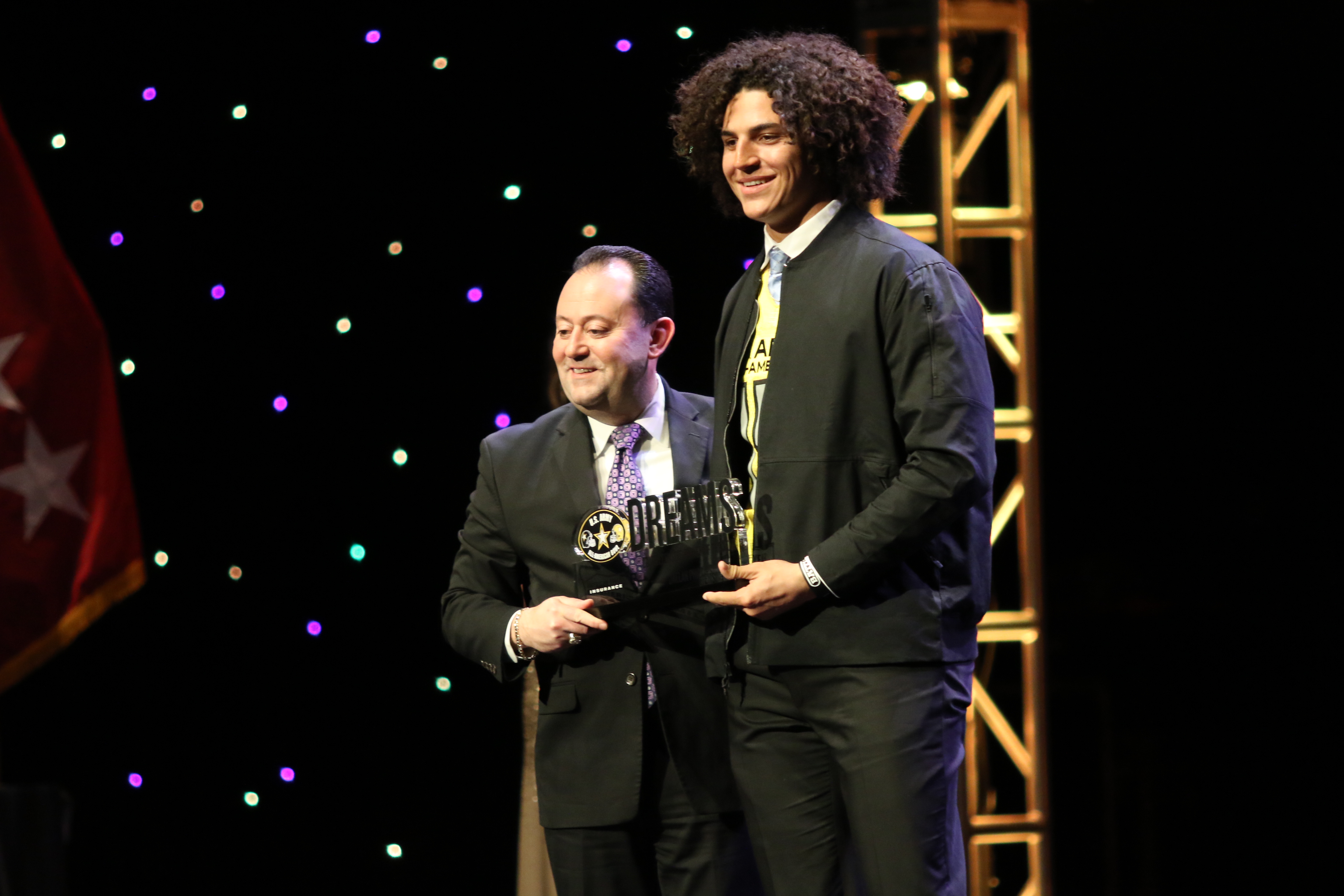 Jaelan Phillips receives his American Family Insurance Defensive Player of the Year award (Photo: AAG)