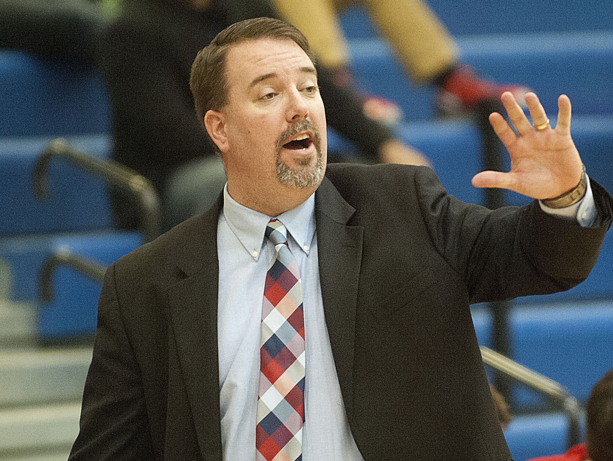 Christian Academy of Louisville Centurians head basketball coach Chad T. Carr shouts instructions to his team during the game in the first round of the boys' Louisville Invitational Tournament. 12 January 2015