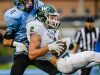 Sy Barnett, 2, of Williamston secures a pass despite the efforts of Konnor Maloney, 4, of Lansing Catholic at the Lansing Catholic 7 yard line late in the 1st quarter in 2015.