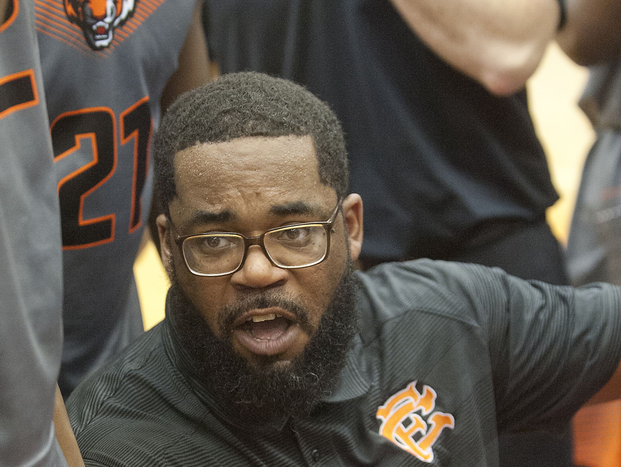 Fern Creek head basketball coach James Schooler, III talks to his players during a time-out. 16 December 2016