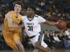 Trinity’s Jay Scrubb (31) drives against St. X’s Tyler Barnes (15) during their game at Broadbent Arena. Jan. 6, 2017
