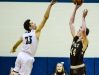 Jaron Faulds, right, of Holt knocks down a jump shot over Brandon Johns of East Lansing to extend the Holt lead to 16 late in the 3rd quarter of their game.