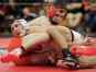 Kaukauna's Trent Leon, left, wrestles Oconto Falls' Kenton Peterson in the 132-pound championship bout at the Pulaski Invite on Jan. 28. Kaukauna has won three straight WIAA Division 1 state titles and will be in a different sectional this year.