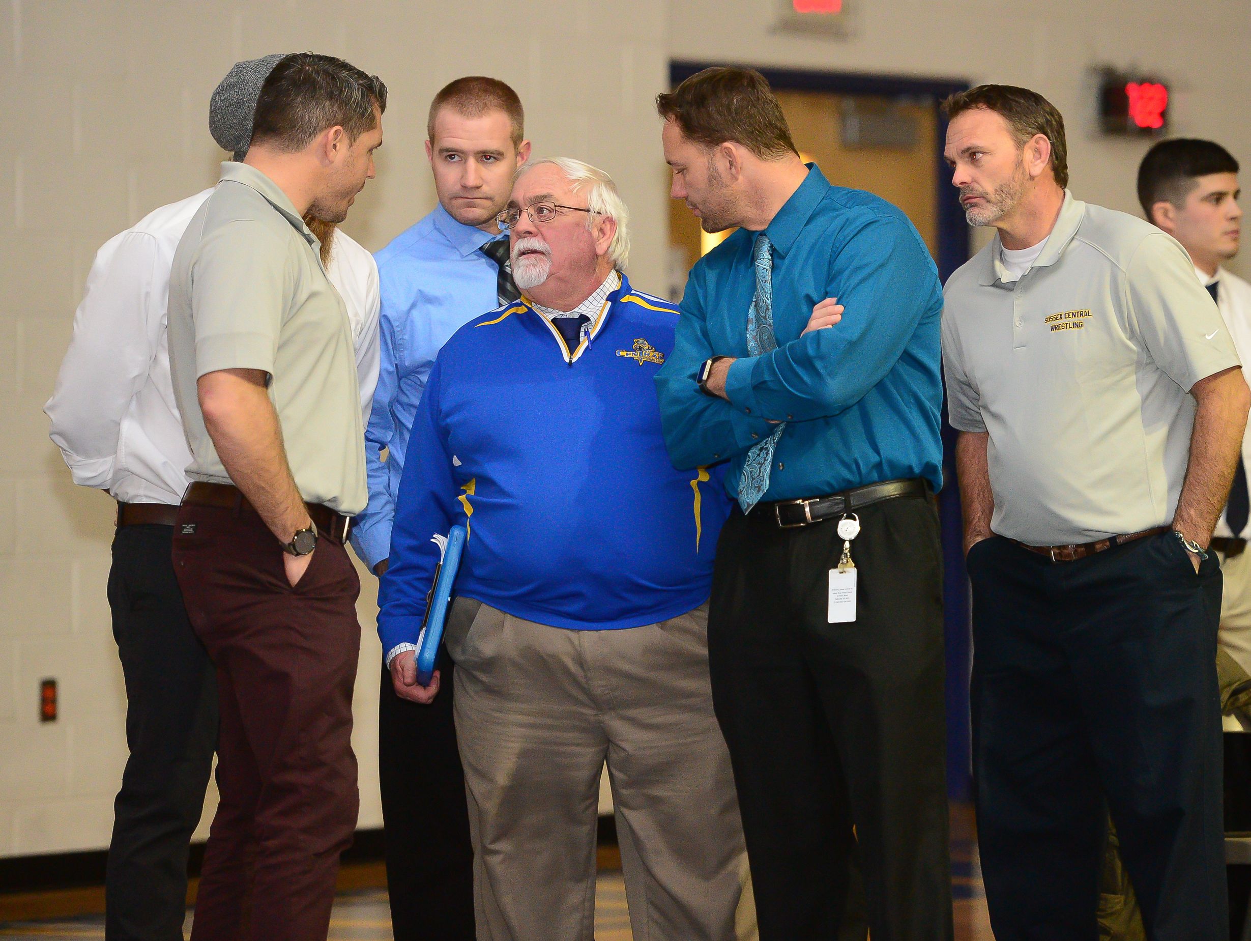 Sussex Central's head Coach Phil Shultie (middle) talks to his assistant coaches during the match up against Poltech on Wednesday, Feb. 2, 2017.
