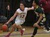 New Paltz's Axel Rodrigues (13) dribbles the ball past Franklin D. Roosevelt's Kevin Henri (12) during basketball game at New Paltz High School on Feb. 3, 2017.