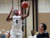 Poughkeepsie's Marvin Lundsford (2) gets fouled as he drives to the basket against Kingston, during the Officials vs Cancer basketball tournament at Dutchess Community College Feb. 4, 2017. Kingston won the game 66-46.