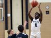 Poughkeepsie's Antawone West (11) puts up a shot against Kingston during the Officials vs Cancer basketball tournament at Dutchess Community College Feb. 4, 2017. Kingston won the game 66-46.