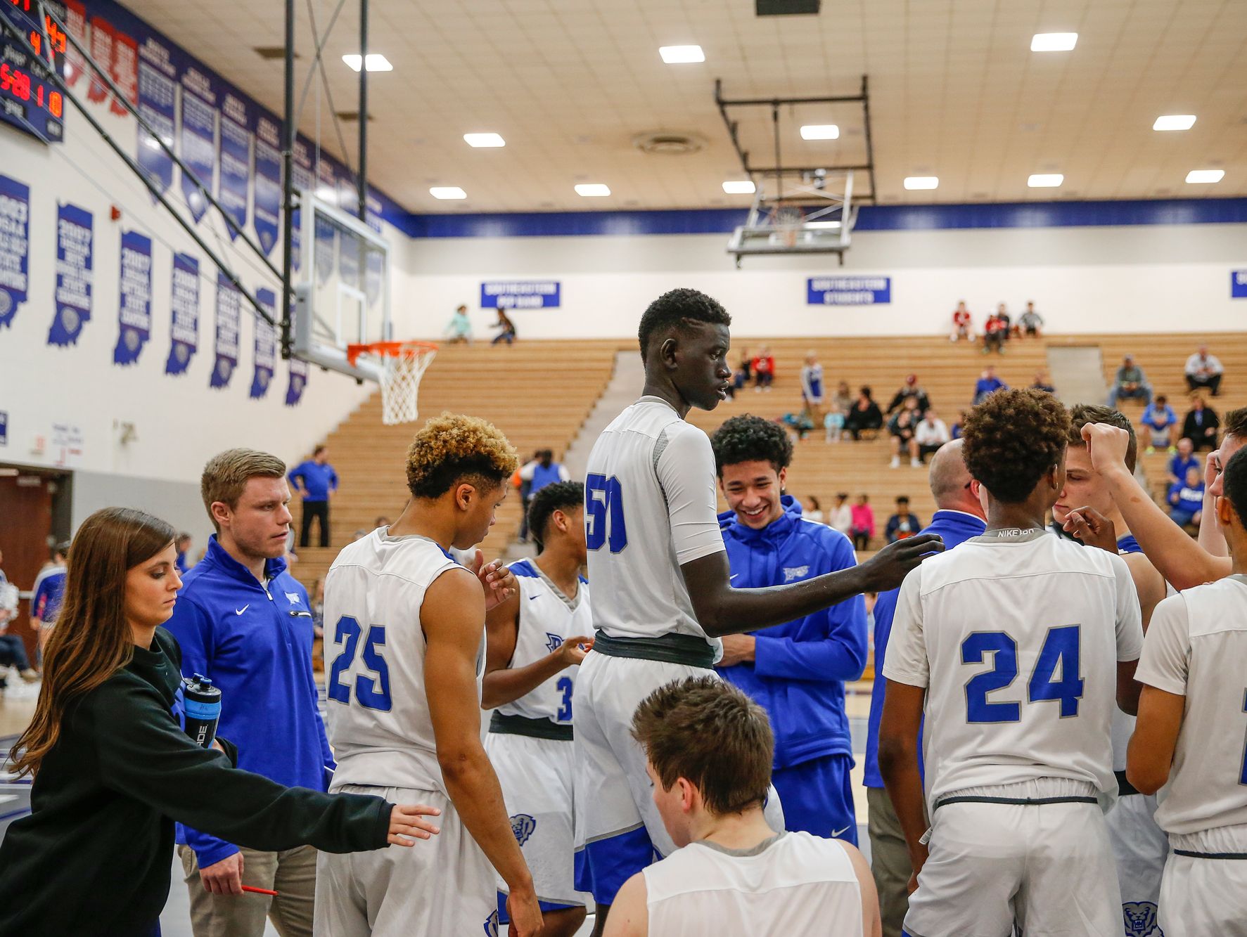 Hamilton Southeastern Royals center Mabor Majak (50), middle, breaks the huddle to start the second half in the game against the New Castle Trojans on Tuesday, Feb. 7, 2017.