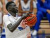 Hamilton Southeastern Royals center Mabor Majak (50) is fouled on his way up for a shot by New Castle Trojans forward Andrew Froedge (20) on Tuesday, Feb. 7, 2017.
