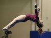 Sioux Falls Roosevelt's Khia Wentzel does a back flip during her floor exercise routine Friday at the Class AA State Gymnastics Meet at the Golden Eagles Arena.