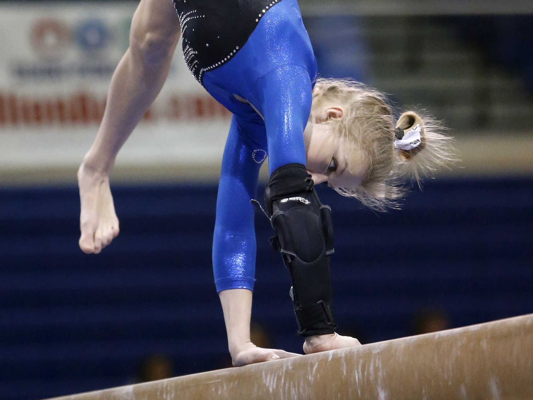 Sioux Falls O'Gorman's Elaina Lubeck performs on the beam Friday at the Class AA State Gymnastics Meet at the Golden Eagles Arena.