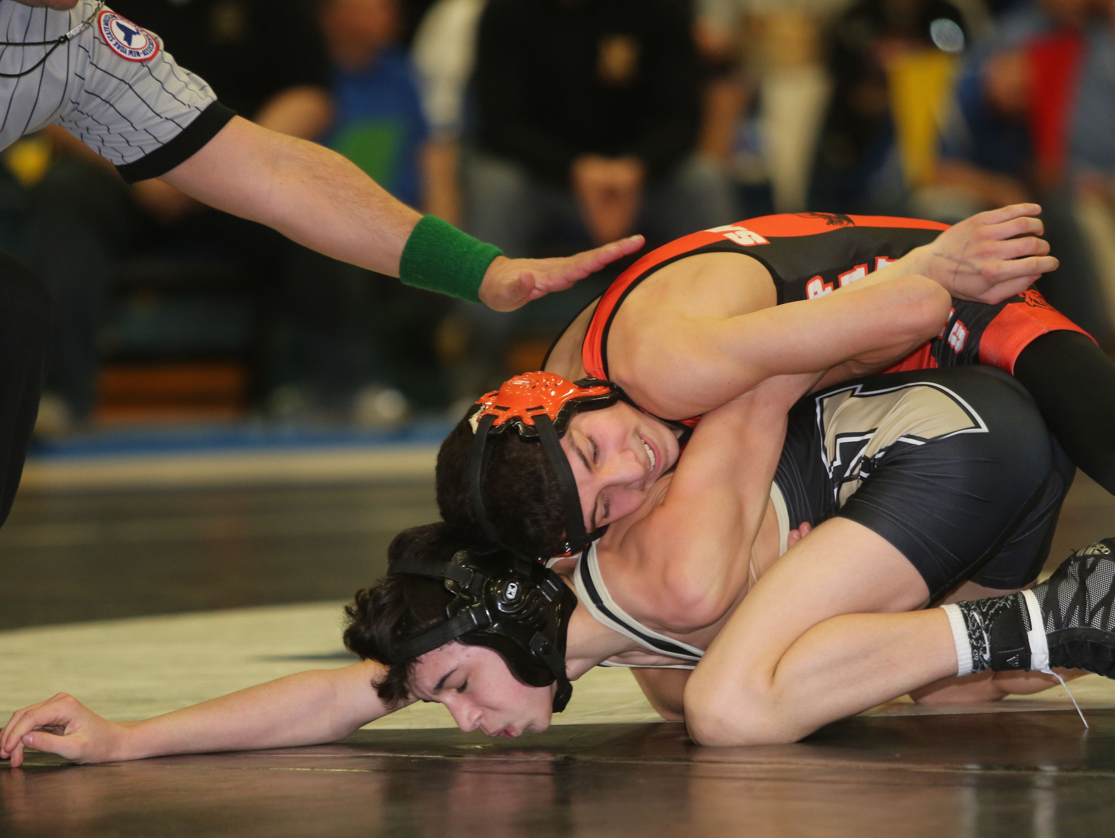 Pawling's Alex Santana, top, on his way to defeating Nanuet's Chris DiModugno in the 99 pound weight class, during the Section 1 Division 2 wrestling championships at Edgemont High School in Scarsdale, Feb. 11, 2017.