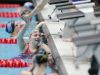 Carmel's Sammie Burchill is congratulated by a team member after the girls 400 yard freestyle relay, during the IHSAA girls swimming state finals, held at IUPUI Natatorium, Feb. 11, 2017.