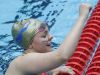 Carmel's Sammie Burchill raises her fist after competing in the girls 100 yard backstroke, during the IHSAA girls swimming state finals, held at IUPUI Natatorium, Feb. 11, 2017.