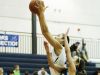 East Lansing's Aaliyah Nye shoots against Grand Ledge juior Maddie McKinley Grand Tuesday, Feb. 14, 2017, at East Lansing.