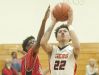 Fern Creek guard-forward Chance Moore puts up a shot over Pleasure Ridge Park center Micah Kinnebrew. Pleasure Ridge Park forward Darius Osborne pressures from behind. 15 February 2017