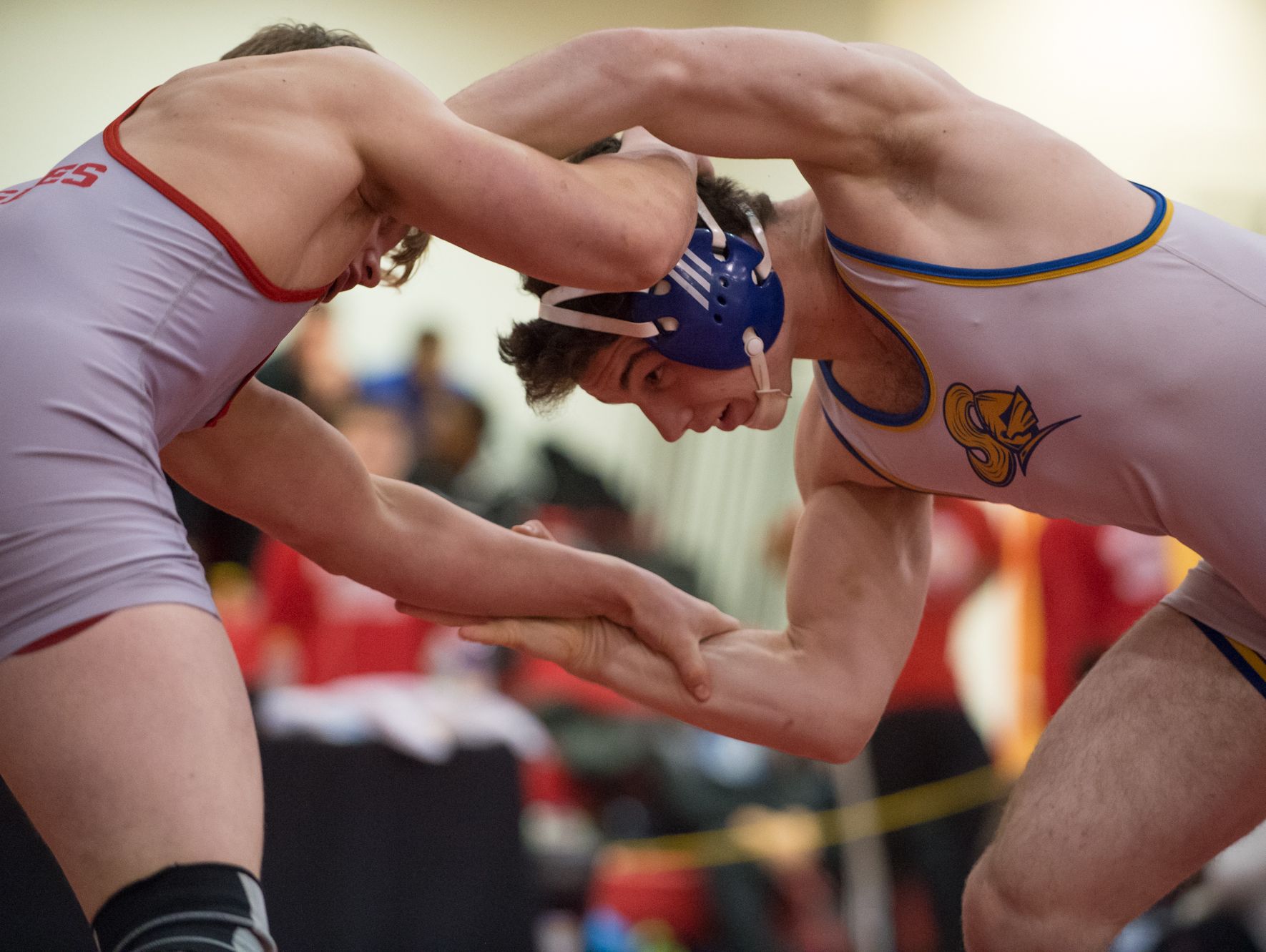 Smyrna's Larsen Wilson, left, and Sussex Central's Lucas Hudson square off in the 182 pound match at DIAA Dual Meet Wrestling State Championship at Smyrna High School.