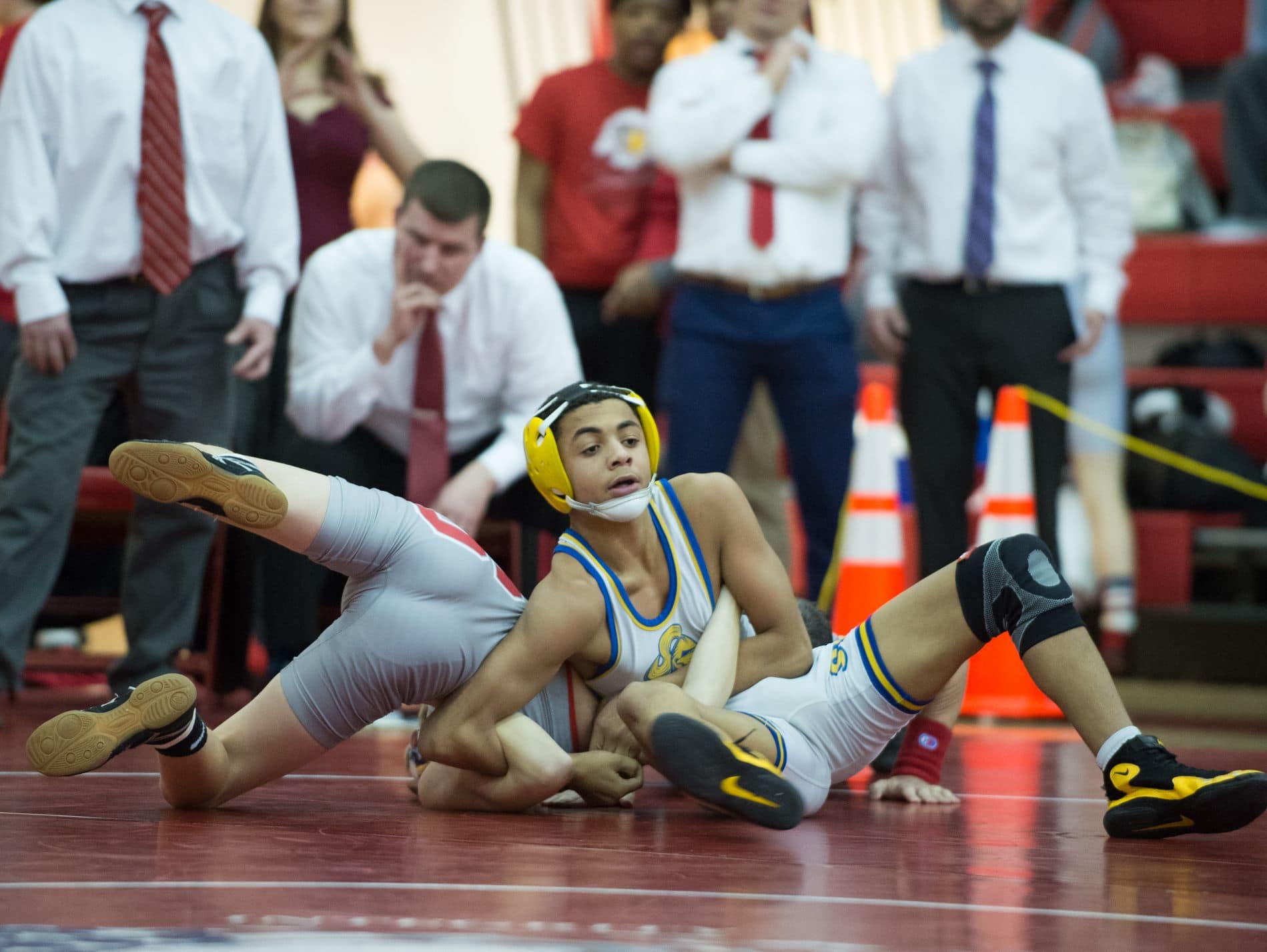Sussex Central's Javon Saffold put Smyrna's Dylan Andruzzi into a hold in the 106 pound match at DIAA Dual Meet Wrestling State Championship at Smyrna High School.