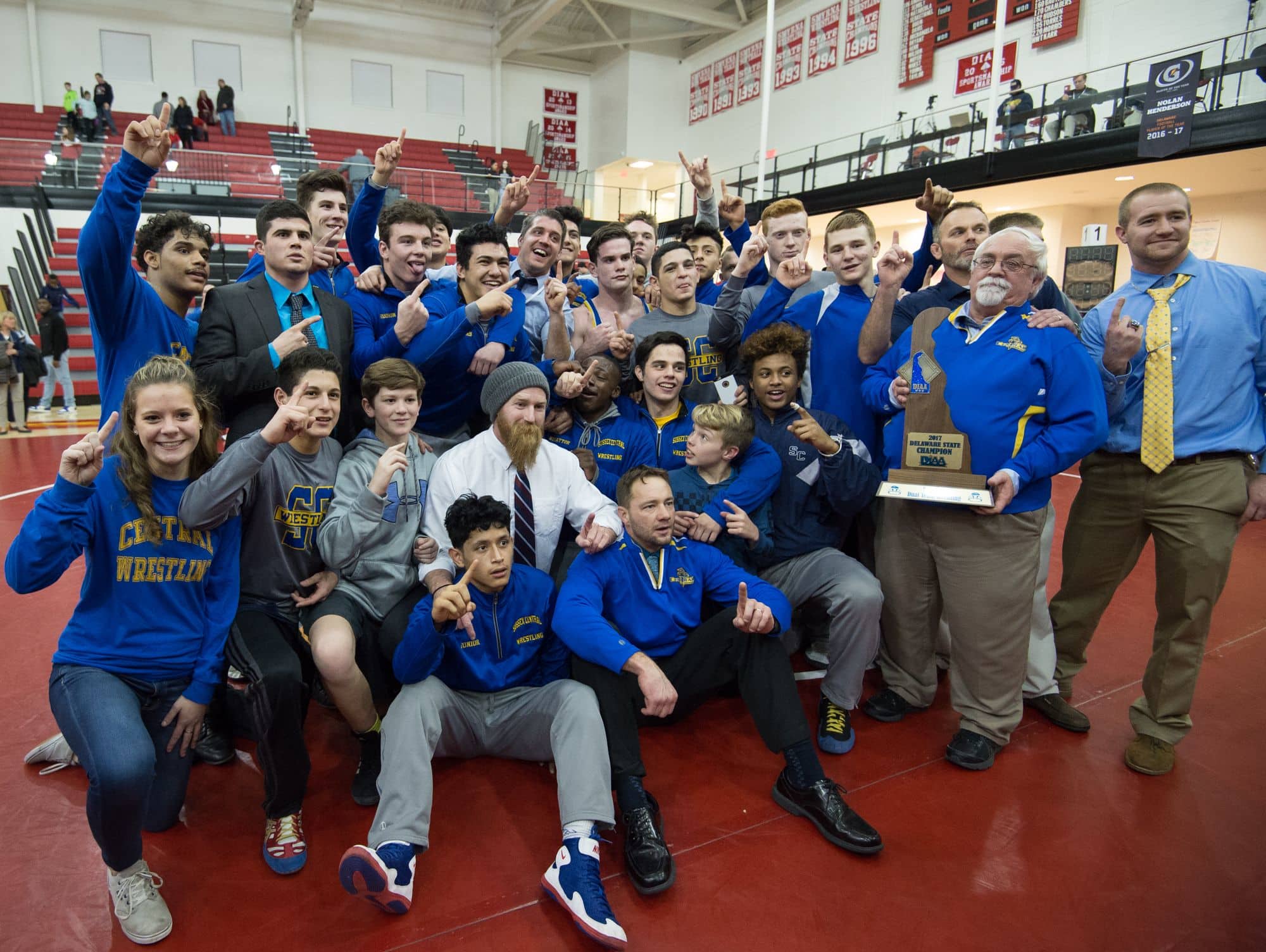 Sussex Central celebrates after defeating Smyrna in the DIAA Dual Meet Wrestling State Championship at Smyrna High School.