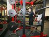 Sophomore Will Tsukamaki does squats in North Salem High School's newly remodeled weight room on Tuesday, Feb. 14, 2017. Tsukamaki and other students helped install the floor during the holiday break in December.