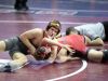 Drew West of Solon wrestles Lucas Carter of Harlan at 126 Lbs. Thursday, Feb. 16, 2017.