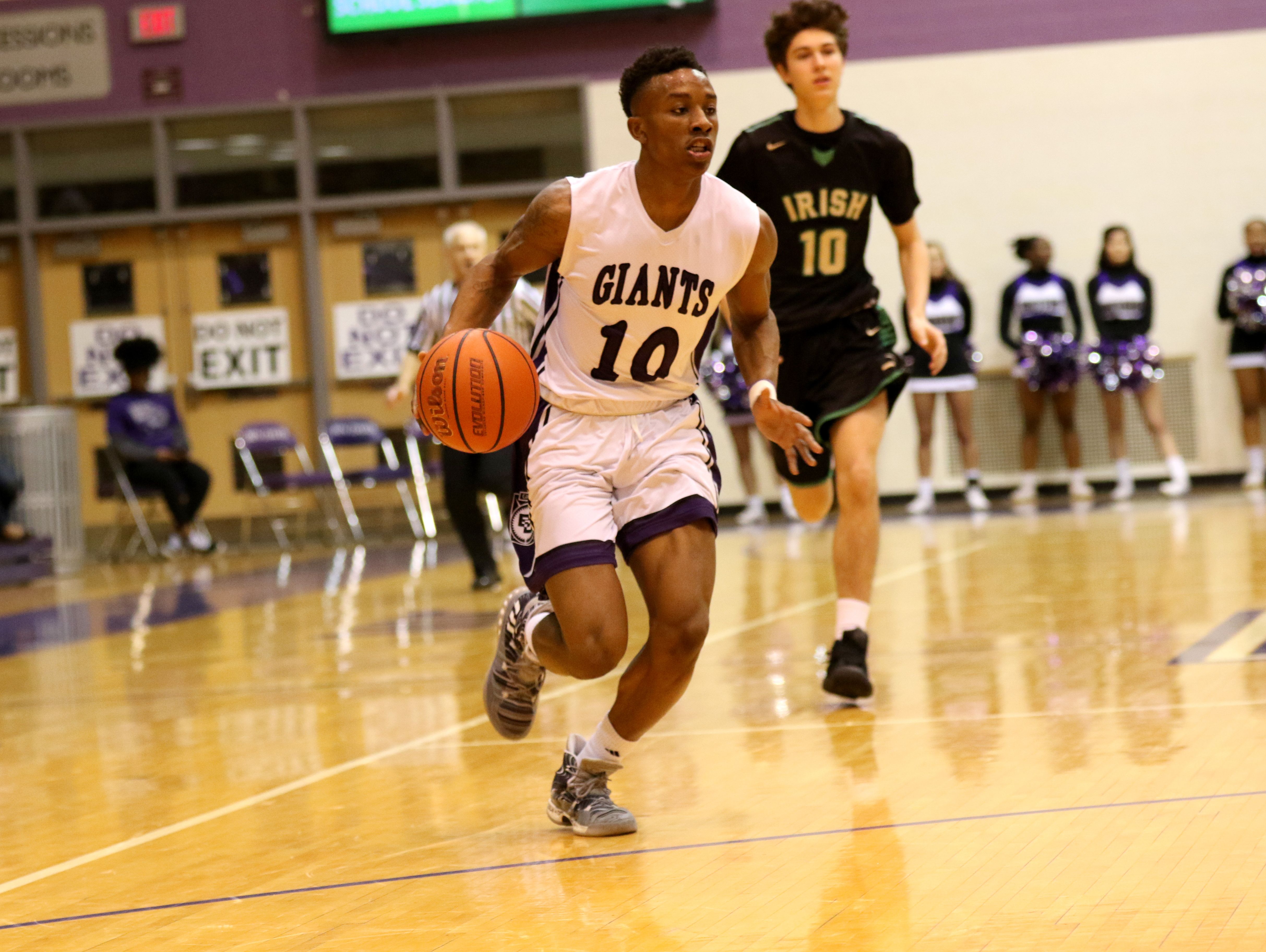 Datrion Harper drives toward the hoop in Ben Davis' heavy win over Cathedral on Friday.