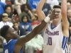 Eastern guard Sugar Ray Wyche gets a hand in the face of the shooting Christian Academy of Louisville guard Parker Jones in the KHSAA 28th District Boys' Basketball Tournament. 21 February 2017
