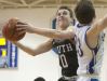 South Oldham guard Joe Griffin looks to shoot over Oldham County forward Zach Larimore in the KHSAA 29th District boys basketball tournament championship game. 23 February 2017
