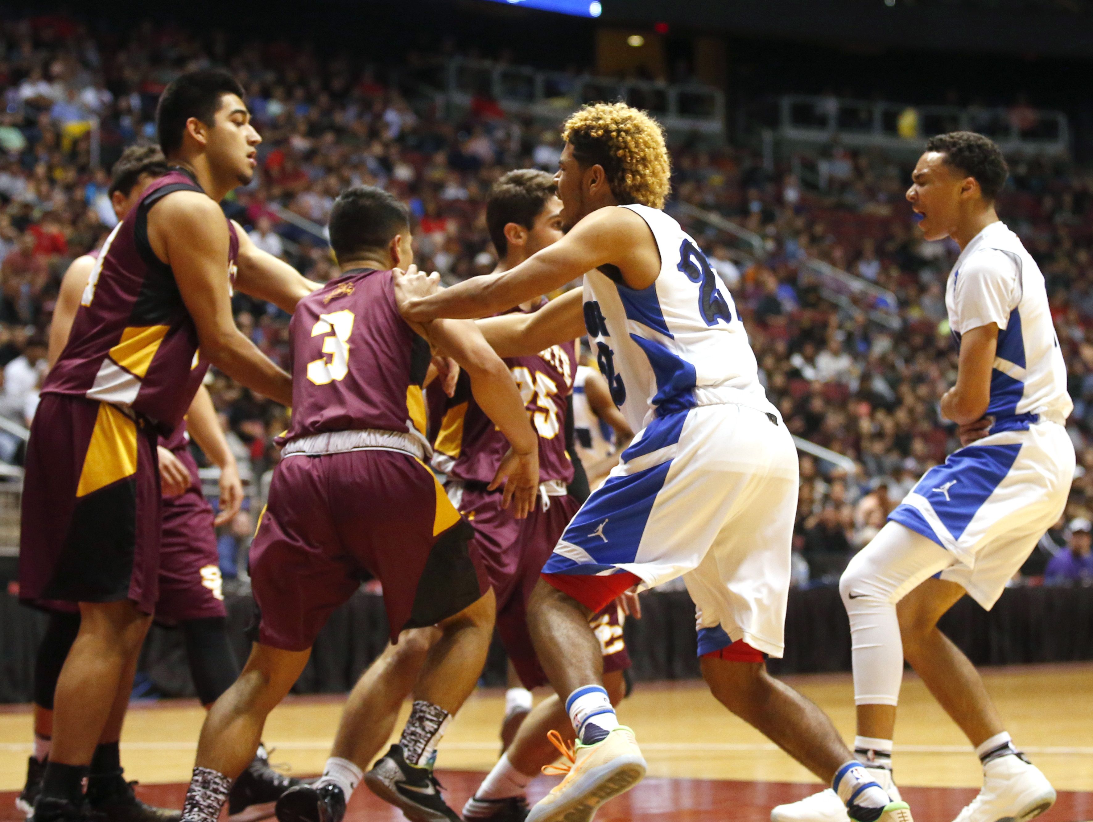 Skirmish on the court during the high school boys basketball: 4A Conference state championship game Salpointe verses Shadow Mountain at Gila River Arena in Glendale on February 25, 2017. Salpointe Isaac Cruz (3) and Shadow Mountain Jaelen House (2) were both ejected.