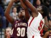 St. Elizabeth's Alanna Speaks (left) tries to shoot past the defense of Ursuline's Kay Wulah in Ursuline's 58-43 home win Wednesday.