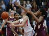 Ursuline's Alisha Lewis (left) goes to the basket in front of St. Elizabeth's Alexis Lee in the second half of Ursuline's 58-43 home win Wednesday.