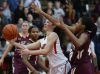 Ursuline's Alisha Lewis (left) goes to the basket in front of St. Elizabeth's Alexis Lee in the second half of Ursuline's 58-43 home win Wednesday.