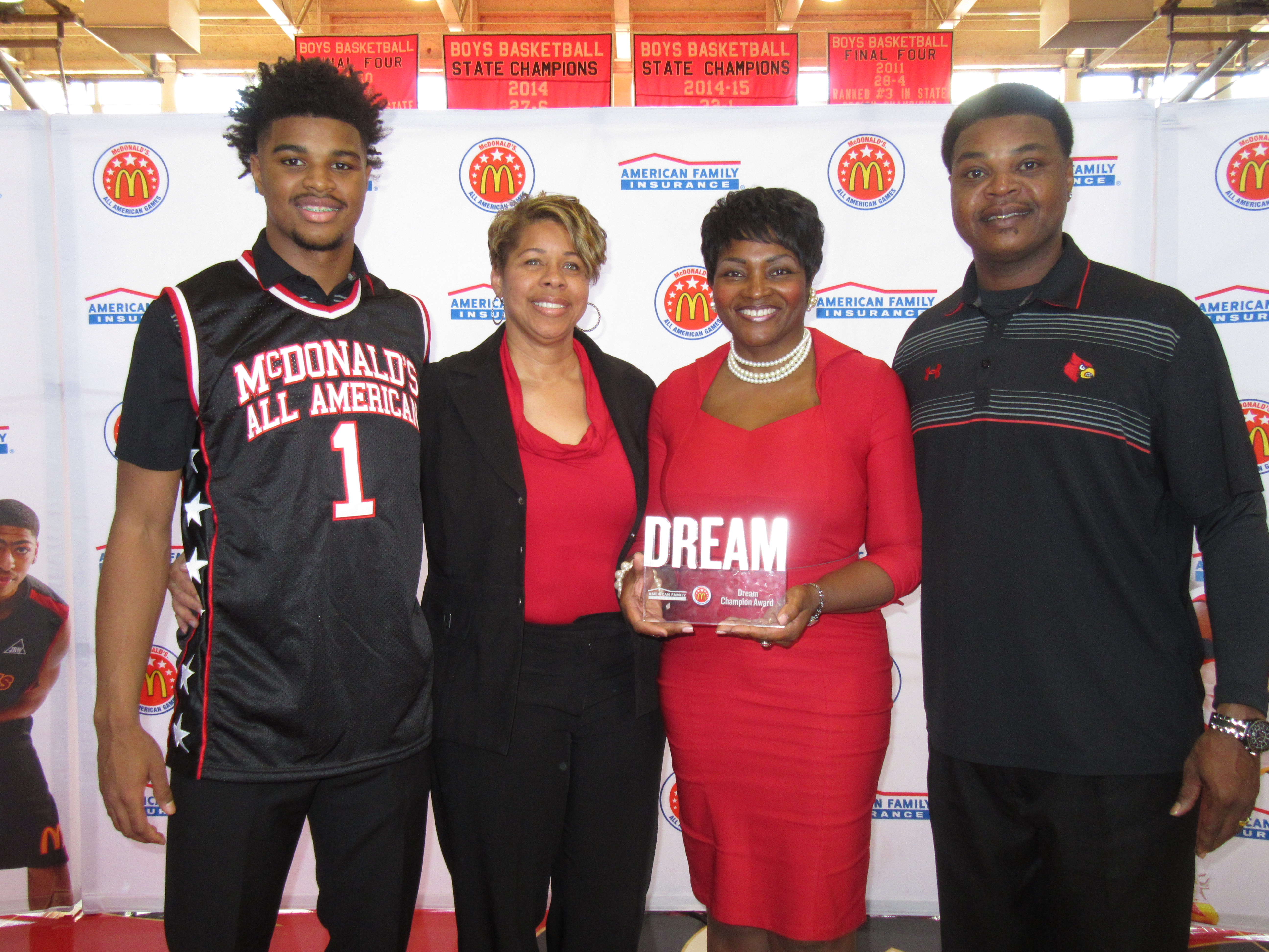 MJ Walker presents his Dream Champion award to his parents. They are joined by a representative from American Family Insurance (Photo: McDAAG)