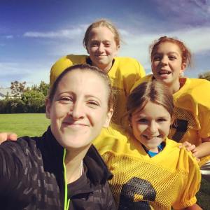Sam Rapoport with a group of female pee wee football players (Photo courtesy of Samantha Rapoport)