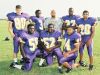 Westgate coach Oliver Winston with some members of the original Tigers’ defense in the program’s first season of 1999.