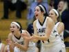 Xavier's Erin Powers (right) and others cheer for their teammates during a comeback run against Seymour in a Bay Conference girls' basketball game Feb. 18 in Appleton.