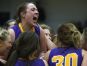 Eastern Pekin's Taylor Drury celebrates with teammates after their victory over Providence in the Indiana girls sectional final. Jan. 4, 2017.