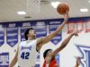 Hamilton Southeastern's Zach Gunn (42) pulls in a rebound over Pike's Darian Porch (32) in the first half of their game Tuesday, February 14, 2017, evening at Hamilton Southeastern High School