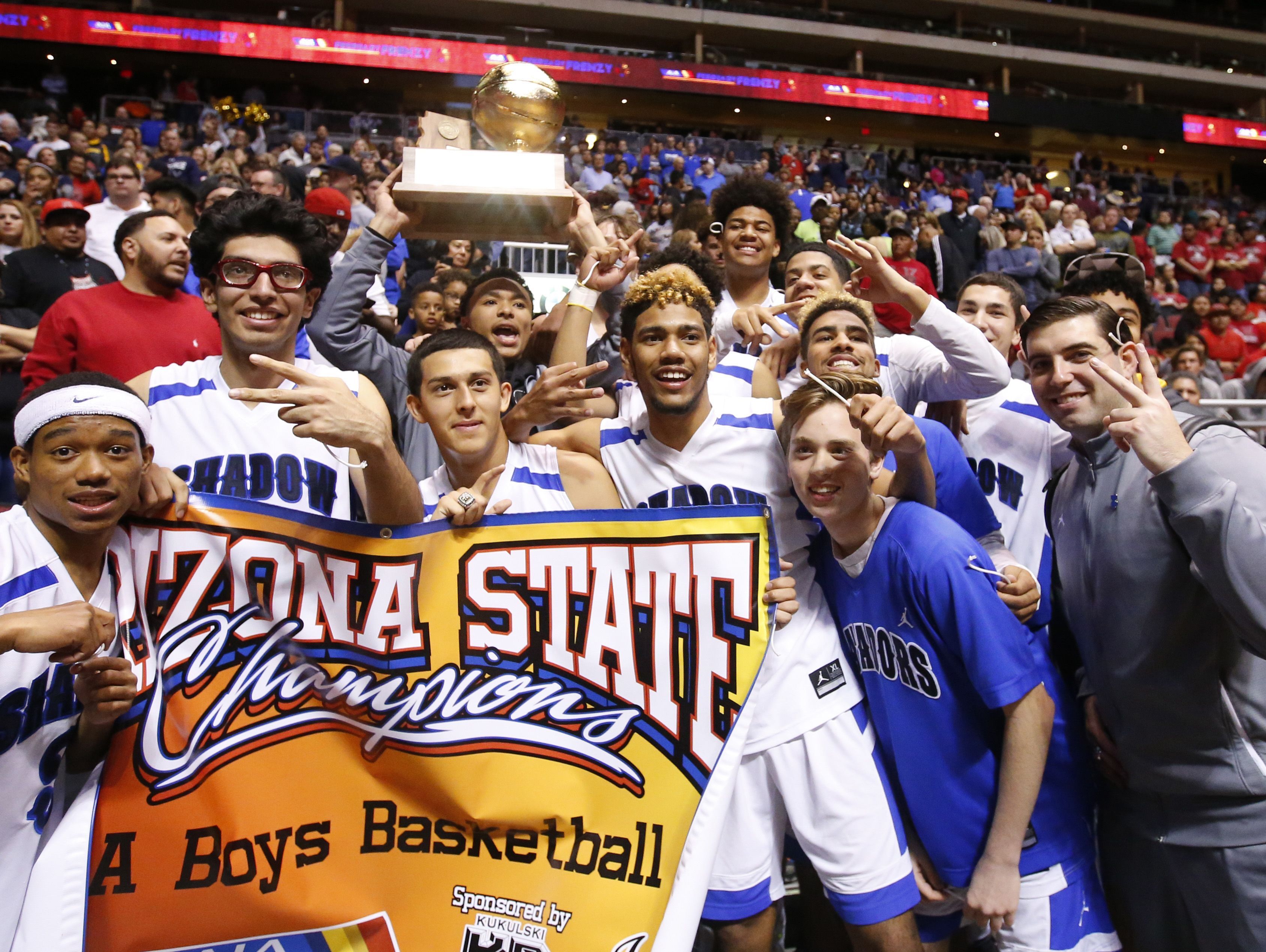 Shadow Mountain celebrates winning the high school boys basketball: 4A Conference state championship game against the Salpointe off court at Gila River Arena in Glendale on February 25, 2017. Shadow Mountain Jaelen House (2) was not allowed on the court after being ejected from the game.