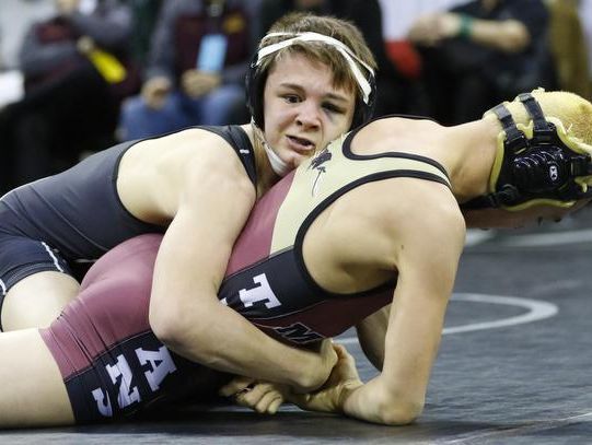 Denmark senior Brock Bergelin, top, wrestles against Melrose-Mindoro's Julian Pumey during their Division 2 120-pound championship match during the WIAA individual state wrestling tournament in Madison.