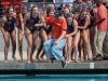 Polytechnic Panthers head coach Ryan Katsuyama takes a celebratory dip into the pool with his team after they beat the Xavier Preparatory Saints 10-5 for the CIF Southern Section Division 5 title in Irvine on Saturday, February 25, 2017.