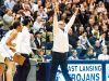 East Lansing coach Steve Finamore celebrates after a Brandon Johns dunk gave his team a 67-63 lead with 21 seconds left in a game against Holt on Jan. 13 in East Lansing.