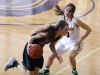 Williamston's Kenzie Lewis, left, drives past Haslett's Sophie Hall during their district semifinal game Wednesday, March 1, 2017, in Fowlerville, Mich. Williamston won 53-42.