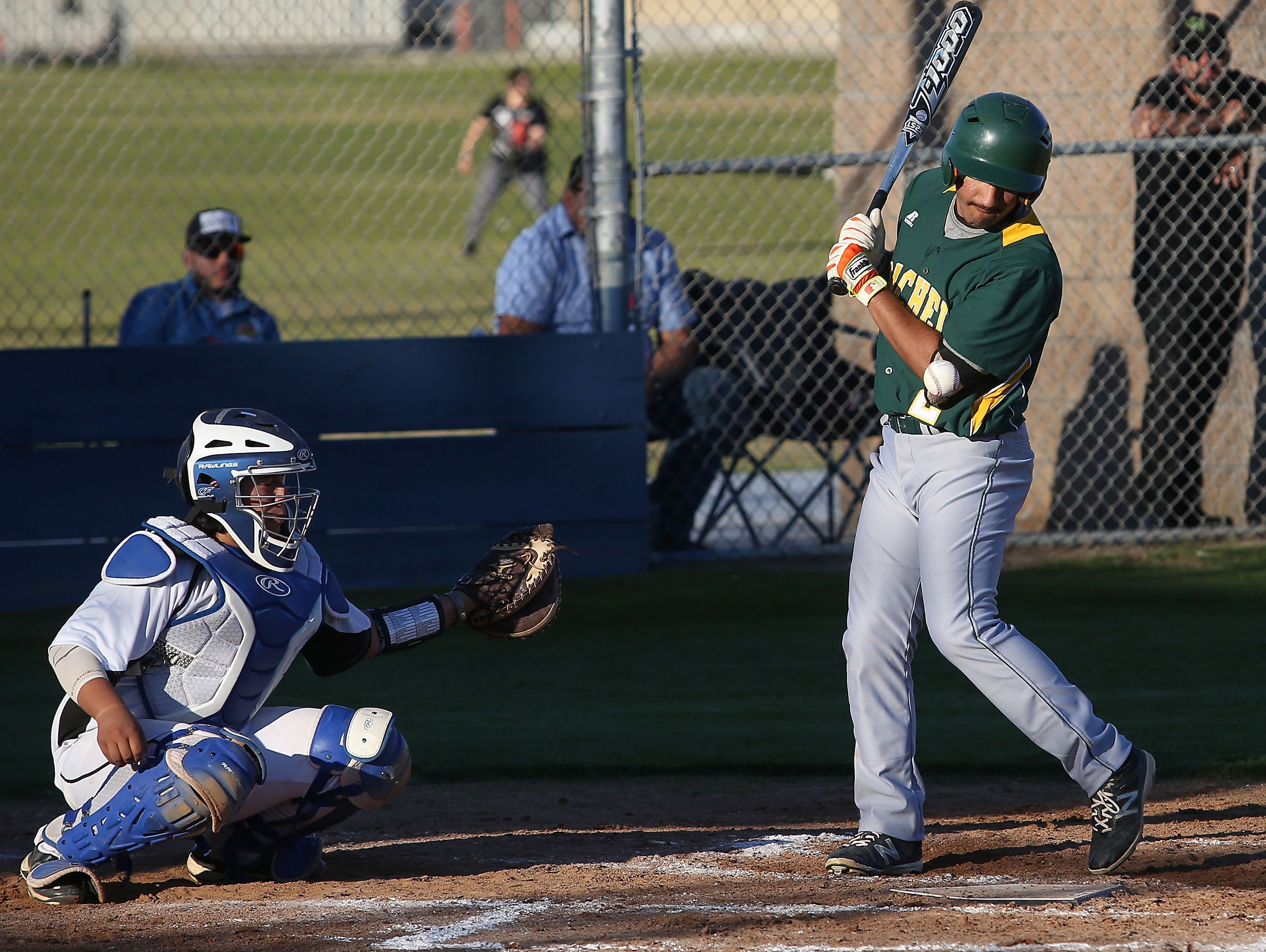Julian Inzunza of Coachella is hit by a pitch during their game against Cathedral City, March 1, 2017.