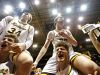 Kickapoo Chiefs players Travis Vokolek (3), Jared Ridder (34), Mitch Closser (44) and Isaac Blakeslee (20) celebrate with their fans after the end of the MSHSAA Class 5 District 11 championship playoff game between the Kickapoo Chiefs and the Ozark Tigers at Hammons Student Center in Springfield, Mo. on March 2, 2017. The Kickapoo Chiefs won the game 52-41.