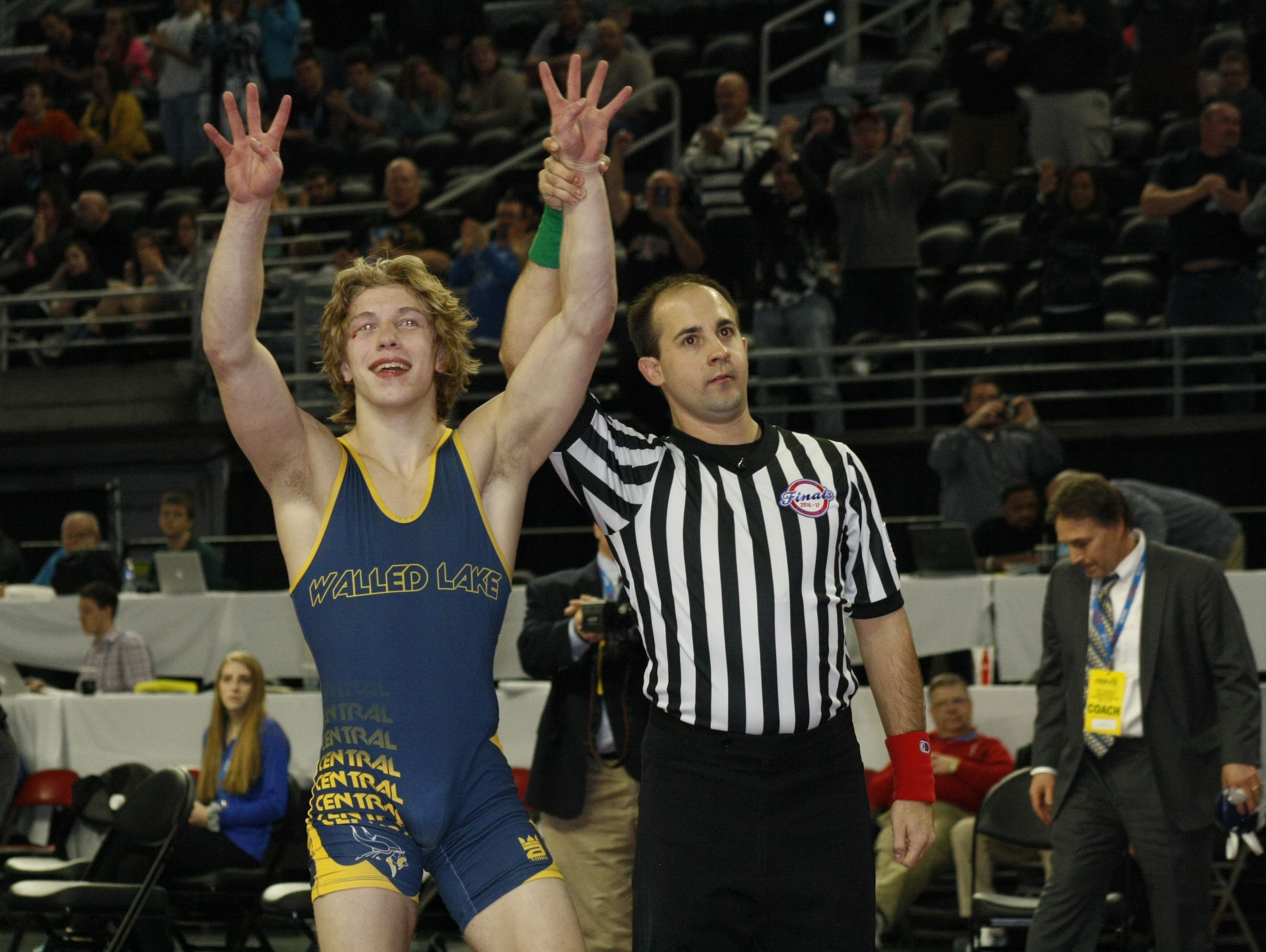Ben Freeman celebrates his fourth state championship with a win Saturday, March 4, 2017, at the Palace of Auburn Hills.