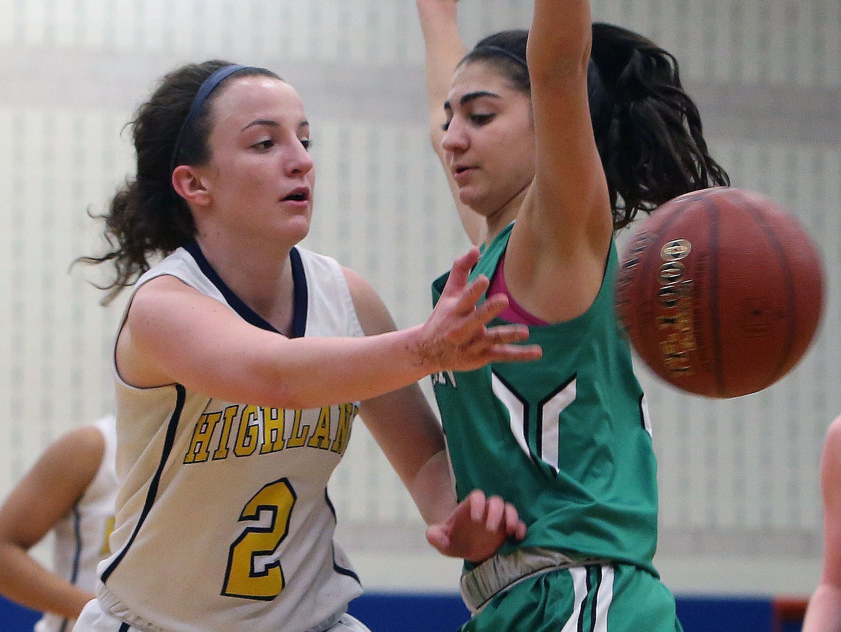 Highland's Brianna Rozzi (2) passes around Irvington's Olivia Valdes (2) during the state regional semifinal at SUNY New Paltz March 7, 2017. Irvington won the game 53-38.